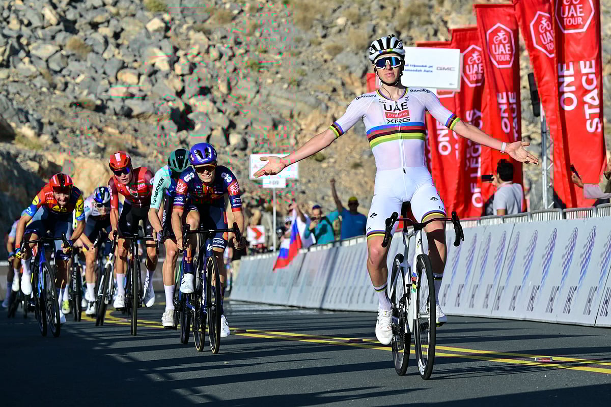 UAE Team Emirates' Slovenian rider Tadej Pogacar celebrates as he crosses the finish line at the end of the seventh stage of the UAE Tour cycling race from Hazza Bin Zayed Stadium to Jebel Hafeet in the UAE on February 23.