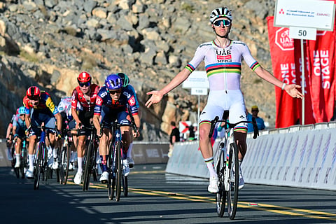 Team Emirates' Slovenian rider Tadej Pogacar celebrates winning the third stage of the UAE Tour cycling race from Ras al Khaimah to Jebel Jais on February 19.