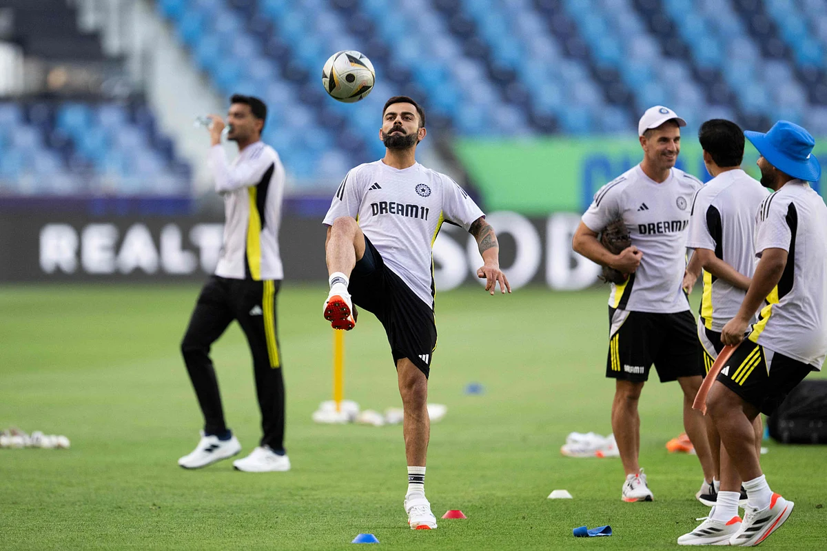 India's Virat Kohli controls a football during a practice session at the Dubai International Stadium in Dubai on February 19.