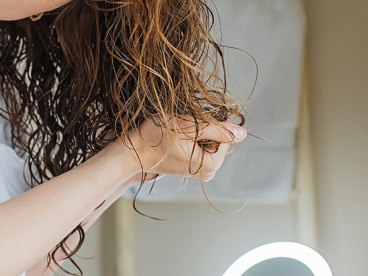 Wet hair is more fragile,  because water weakens the hydrogen bonds that provide strength and elasticity