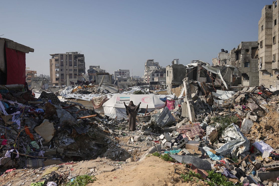A Palestinian woman reacts to the destruction in Jabalia in the northern Gaza Strip on February 17, 2025. 