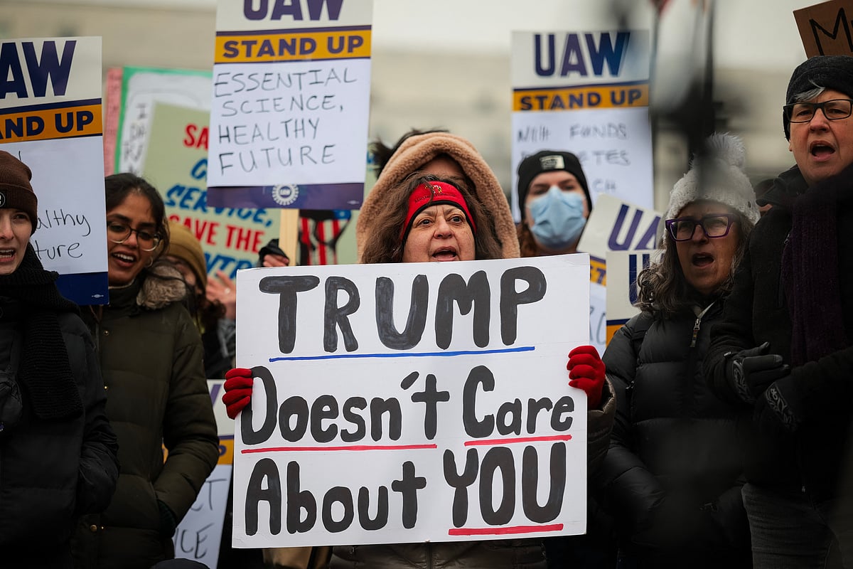 Federal workers and supporters rally outside of the Department of Health and Human Services on February 19, 2025 in Washington,