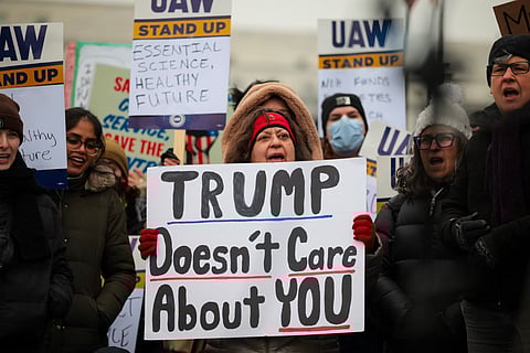 Federal workers and supporters rally outside of the Department of Health and Human Services on February 19, 2025 in Washington, 
