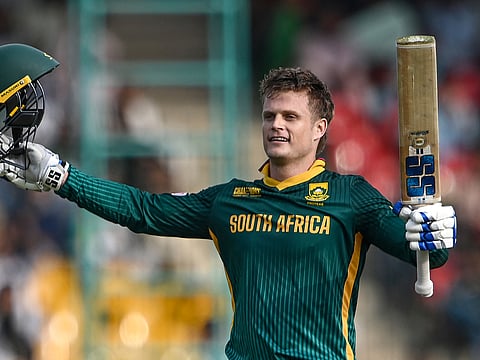 South Africa's Ryan Rickelton celebrates after scoring a century during the ICC Champions Trophy ODI match against Afghanistan at the National Stadium in Karachi on February 21, 2025.