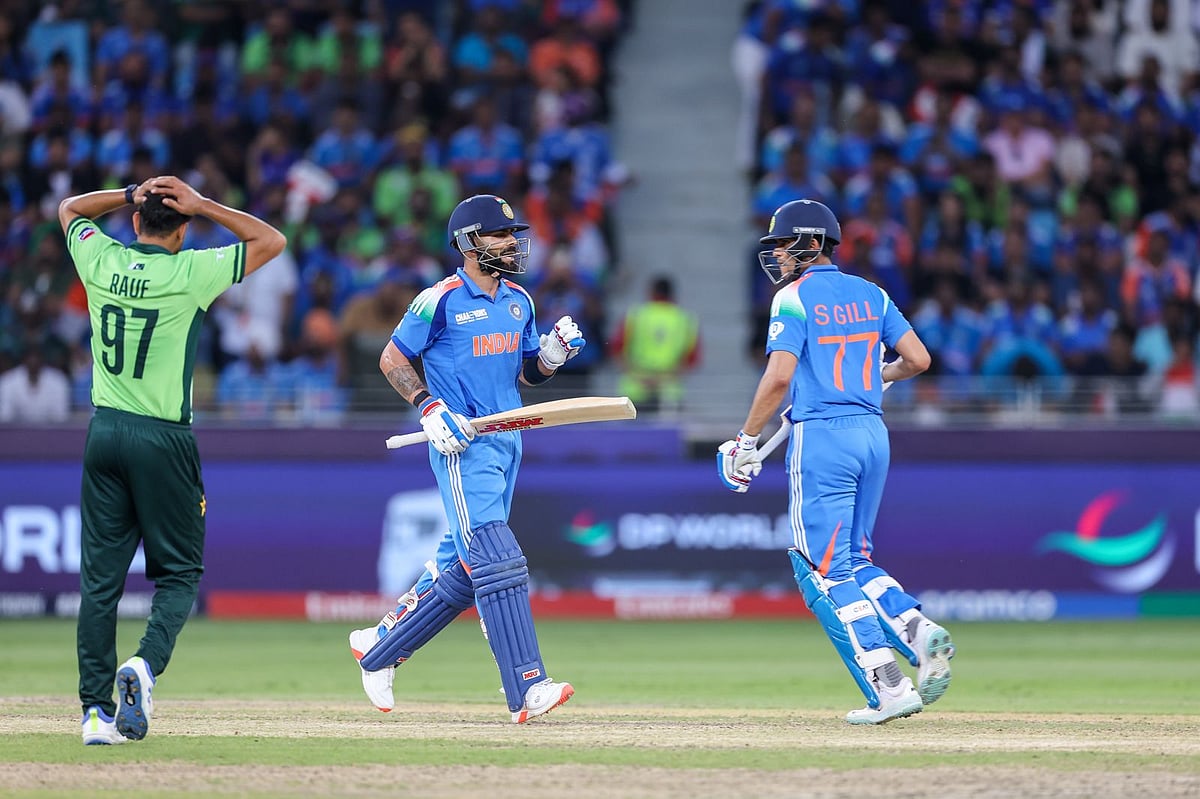 Indian batsmen Shubman Gill and Virat Kohli during their second-wicket partnership against Pakistan in the Champions Trophy match at Dubai International Stadium on Sunday.
