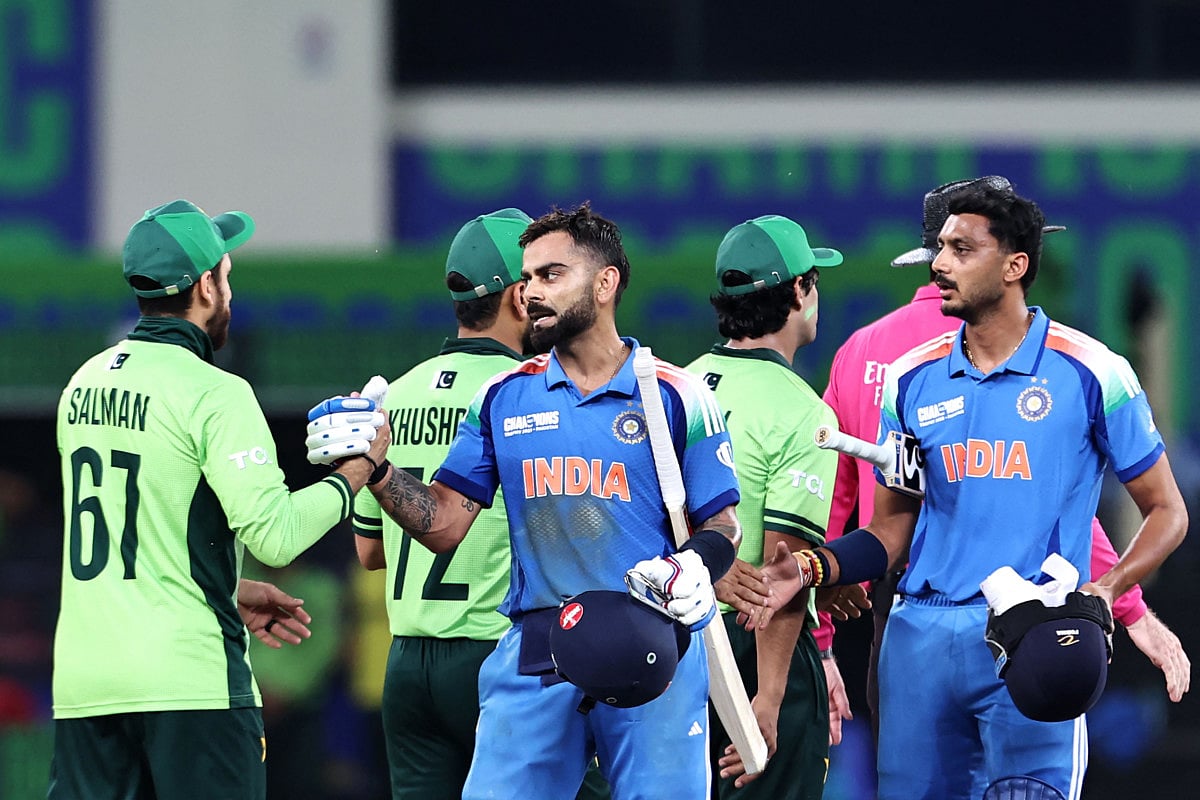India's Virat Kohli and Axar Patel greet Pakistan's players at the end of the ICC Champions Trophy One-Day International (ODI) cricket match at the Dubai International Stadium on February 23.