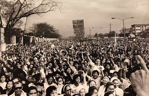 PEACE OVER VIOLENCE: A scene during the EDSA "People Power" revolution in February 1986. The event is a shining moment in the history of the world, which ushered in a peaceful revolt and the ouster of the 21-year Marcos dictatorship.  
