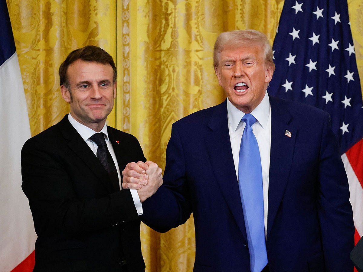 US President Donald Trump and French President Emmanuel Macron shake hands at the end of a joint press conference in the East Room to the White House in Washington, DC.