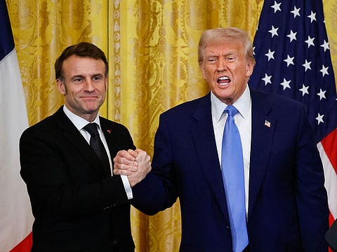 US President Donald Trump and French President Emmanuel Macron shake hands at the end of a joint press conference in the East Room to the White House in Washington, DC.