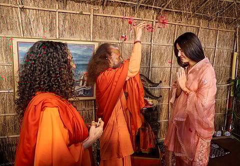 Prayagraj, Feb 24 (ANI): Parmarth Niketan Ashram President Swami Chidanand Saraswati blesses Bollywood actor Katrina Kaif during her visit to the Parmarth Niketan Ashram in the ongoing 'MahaKumbh Mela 2025', in Prayagraj on Monday. Sadhvi Bhagawati Saraswati is also seen. (ANI Photo)