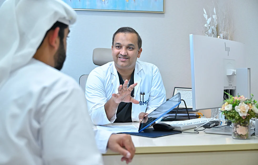Dr Niyas Khalid of Burjeel Medical City with Muhammad who received innovative treatment for rare liver disease