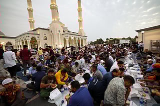 Residents enjoy the first iftar of the holy month of Ramadan at the Al Farooq Omar Bin Al Khattab Mosque, popularly known as the
Blue Mosque, in Dubai. 