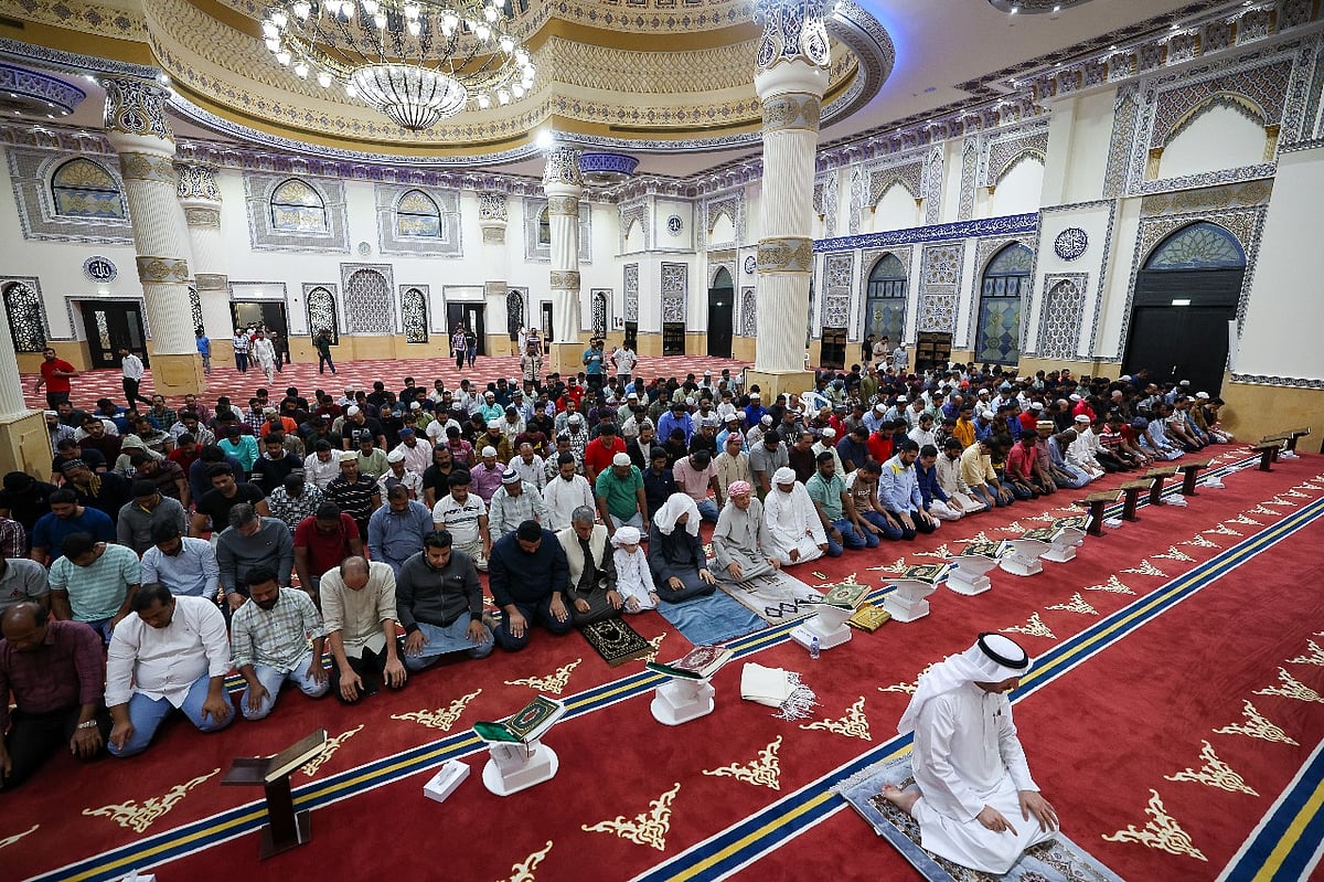The faithful perform prayers after Iftar on the first day of Ramadan at Al Farooq Omar bin Al Khattab Mosque (Blue Mosque) in Dubai.