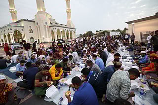 Residents enjoy the first iftar of the holy month of Ramadan at the Al Farooq Omar Bin Al Khattab Mosque, popularly known as the Blue Mosque, in Dubai (from March 1, 2025). 