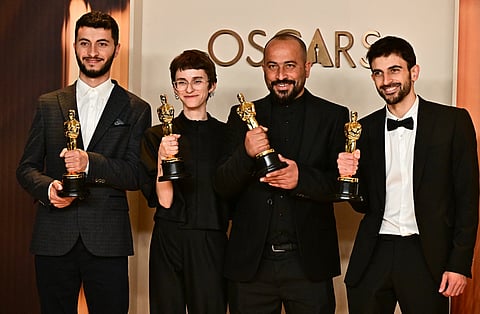 Israeli journalist and filmmaker Yuval Abraham, US producer Rachel Szor, filmmaker Hamdan Ballal, Palestinian journalist and filmmaker Basel Adra pose in the press room with the Oscar 