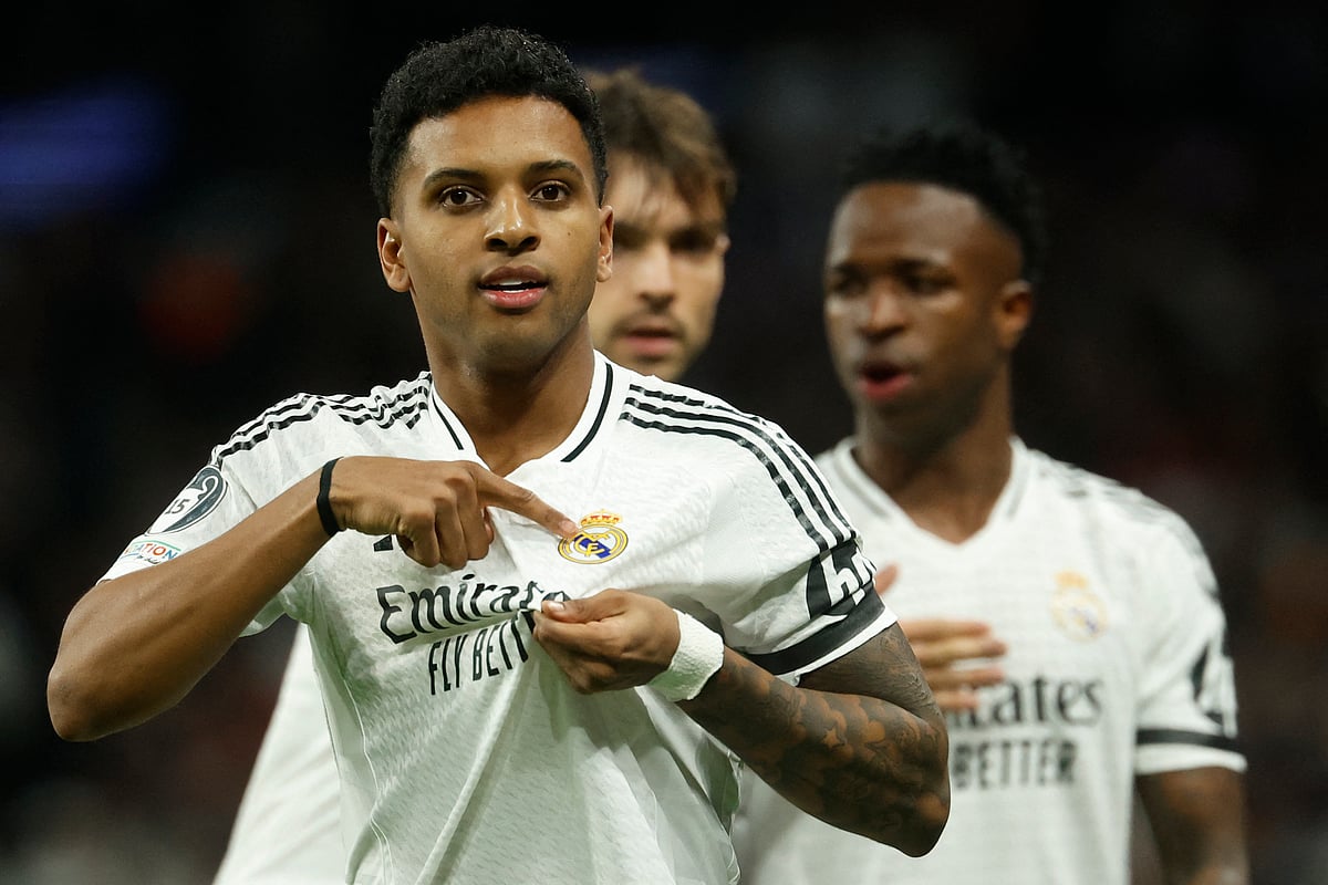 Real Madrid's Brazilian forward Rodrygo celebrates scoring the opening goal in the Madrid derby