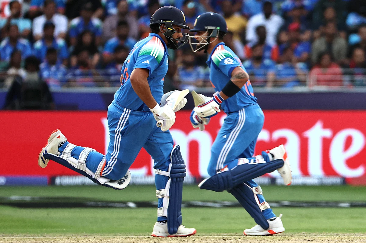 India's captain Rohit Sharma (L) and teammate Virat Kohli run between the wickets during the ICC Champions Trophy one-day international (ODI) semi-final cricket match between Australia and India at the Dubai International Stadium in Dubai on March 4, 2025.