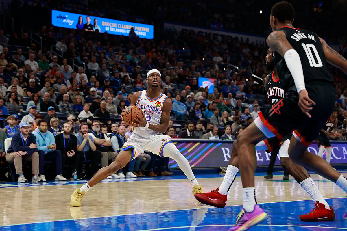 Shai Gilgeous-Alexander #2 of the Oklahoma City Thunder handles the ball during the game against the Houston Rockets at Paycom Center in Oklahoma City, Oklahoma.