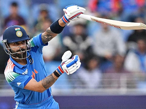 India's Virat Kohli watches the ball after playing a shot during the ICC Champions Trophy ODI semi-final match against Australia at the Dubai International Stadium in Dubai on March 4, 2025. 