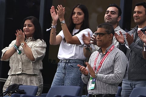 Anushka Sharma (2L), wife of Indian cricketer Virat Kohli, applauses from the stands after Kohli was dismissed during the ICC Champions Trophy one-day international (ODI) semi-final cricket match between Australia and India at the Dubai International Stadium in Dubai on March 4.