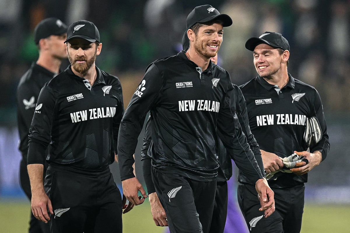 New Zealand's captain Mitchell Santner (C) and his teammates gesture after winning the ICC Champions Trophy one-day international (ODI) semi-final cricket match between New Zealand and South Africa at the Gaddafi Stadium in Lahore on March 5, 2025.