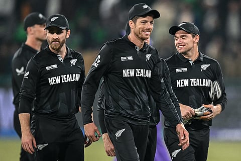 New Zealand's captain Mitchell Santner (C) and his teammates gesture after winning the ICC Champions Trophy one-day international (ODI) semi-final cricket match between New Zealand and South Africa at the Gaddafi Stadium in Lahore on March 5, 2025.