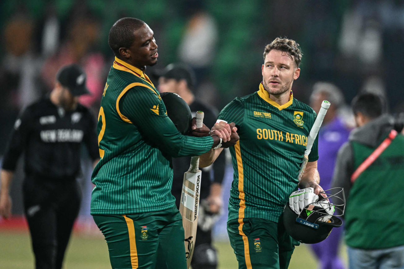 South Africans David Miller (right) shakes hands with Lungi Ngidi after losing the semi-finals against New Zealand in Lahore on Wednesday.