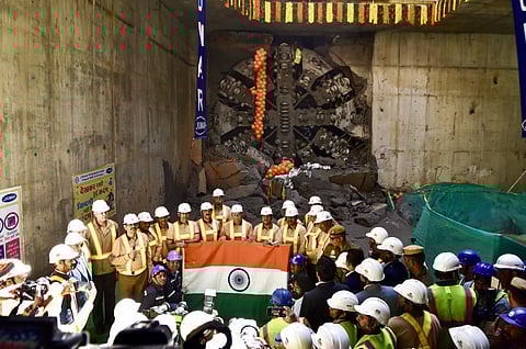 Union Minister of Housing and Urban Affairs Manohar Lal Khattar in a group picture with engineers and metro construction workers during Tunnel breakthrough for DMRC.