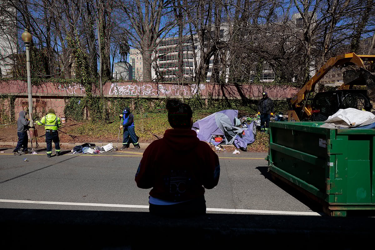 City officials and law enforcement clear out a homeless encampment near the US State Department on March 07, 2025 in Washington, DC. 