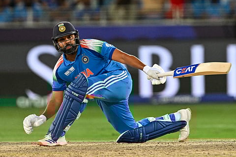 India's captain Rohit Sharma plays a shot during the ICC Champions Trophy one-day international (ODI) final cricket match between India and New Zealand at the Dubai International Stadium in Dubai on March 9, 2025.