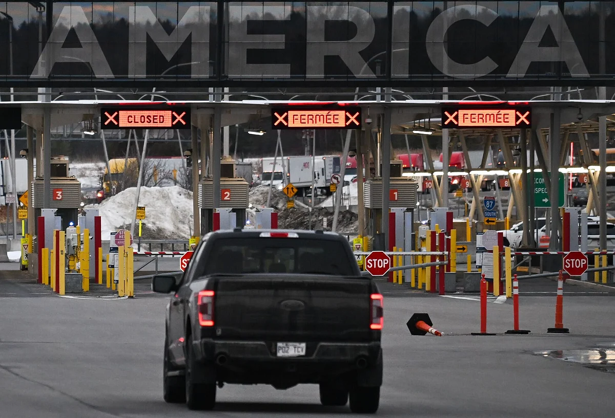 A vehicle travelling into the United States at the Canada-US border in St-Bernard-de-Lacolle, Quebec, Canada, on Thursday, March 6, 2025. Just three countries, China, Mexico and Canada accounted for $430.5 billion of US trade deficit in 2024. 