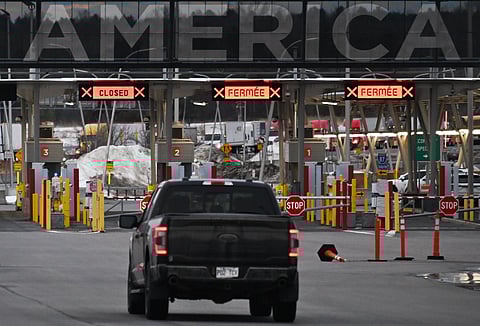 A vehicle travelling into the United States at the Canada-US border in St-Bernard-de-Lacolle, Quebec, Canada, on Thursday, March 6, 2025. Just three countries, China, Mexico and Canada accounted for $430.5 billion of US trade deficit in 2024. 