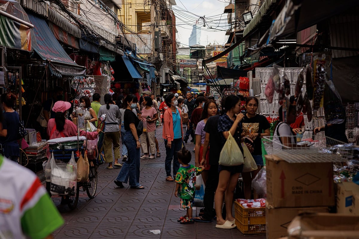 Shoppers at a market in Bangkok. About 2.7 million beneficiaries in the age group will receive 10,000 baht ($295.82) each, with the disbursement set to be made through a new “digital wallet” application meant to boost spending.