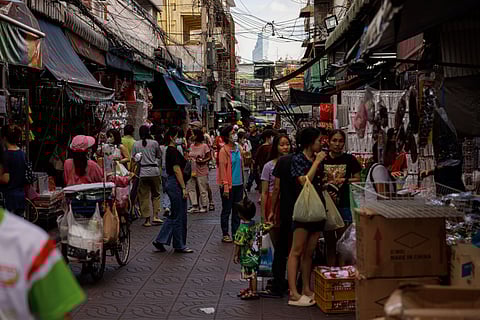 Shoppers at a market in Bangkok. About 2.7 million beneficiaries in the age group will receive 10,000  baht ($295.82) each, with the disbursement set to be made through a new “digital wallet” application meant to boost spending.