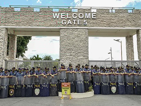The police gather outside the Villamor Air Base where supporters of former Philippines' president Rodrigo Dutertein are protesting in Pasay, Metro Manila.