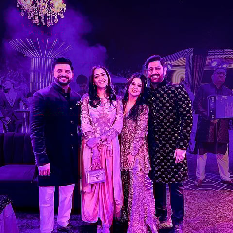 Mahendra Singh Dhoni with his wife Sakshi and Suresh Raina with Priyanka attend the wedding of Rishabh Pant's sister.