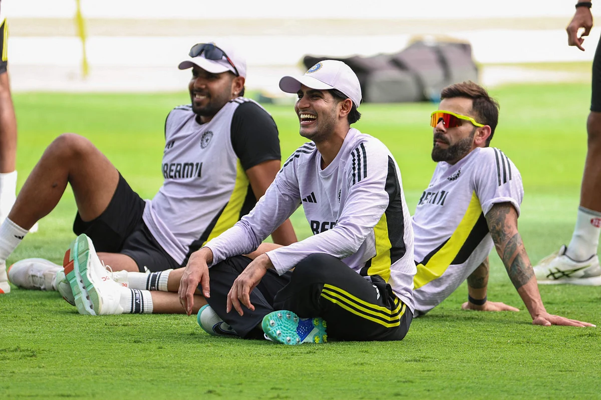 India's Shubman Gill (centre), Virat Kohli (right)  and Harshit Rana having a laugh during a practice session ahead of the Champions Trophy final at Dubai International Stadium.