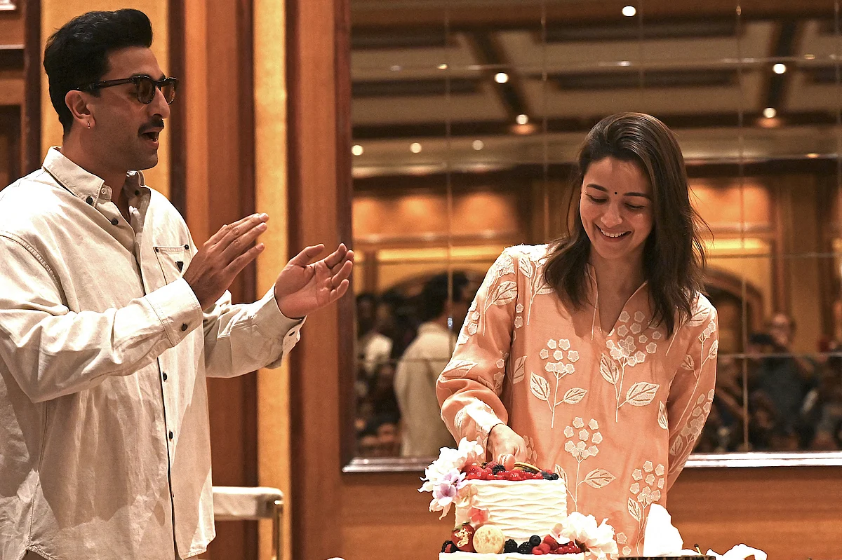 Bollywood actor Ranbir Kapoor (L) takes part in the birthday celebrations of his actress wife Alia Bhatt, in Mumbai on March 13, 2025.