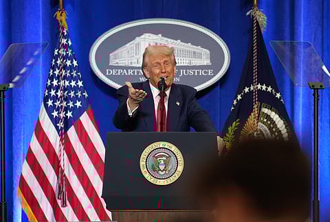 US President Donald Trump gestures while speaking at the Justice Department in Washington, DC. 