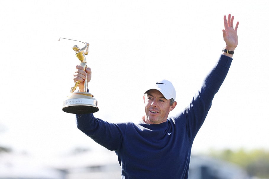 Rory McIlroy of Northern Ireland celebrates with the trophy after winning the playoff in the final round of The Players Championship on the Stadium Course at TPC Sawgrass on March 17 in Ponte Vedra Beach, Florida.