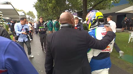 An emotional Hadjar received a hug in the paddock from Lewis Hamilton’s father Anthon