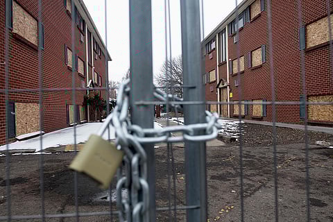 A padlock hangs from a chain link fence at the Edge at Lowry apartment complex in Aurora, Colorado, which came under national scrutiny after a video of armed Venezuelan gang members rooming the hallways of the complex went viral. US President Donald Trump used the incident as a rallying cry for his anti-immigration stance during the past US presidential election, declaring that Aurora was a crime-ridden city overrun by the Venezuelan gang Tren de Aragua.