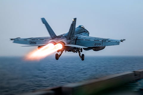 A US F/A-18 Super Hornet attack fighter jet taking off from the US Navy's Nimitz-class USS Harry S. Truman aircraft carrier at sea on March 16, 2025.