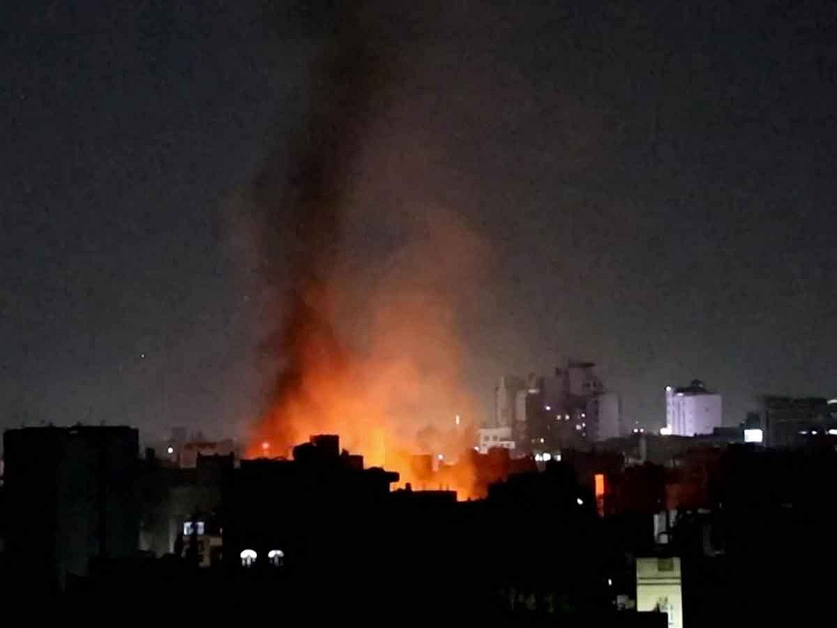 This image grab from an AFPTV footage shows smoke plumes rising above buildings following bombardment on Yemen's Houthi-controlled capital Sanaa on March 19, 2025. Huthi media reported multiple US strikes on March 19 in rebel-held areas around Yemen including the capital Sanaa, as the US military said its campaign against the Iran-backed rebels was ongoing. 