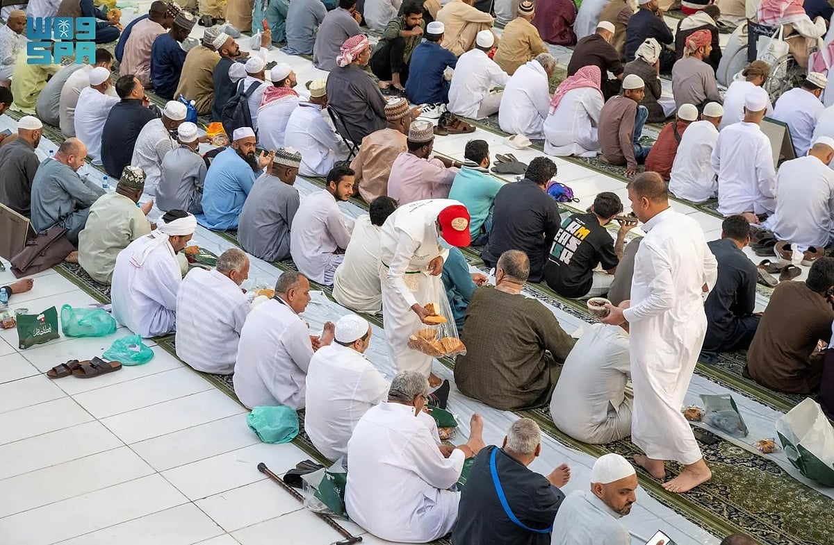 Worshippers break their day-long fast in Ramadan with Iftar meals in the Prophet's Mosque.