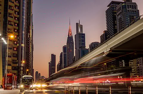 This slow shutter photograph shows vehicles driving on the Sheikh Zayed Road in Dubai.