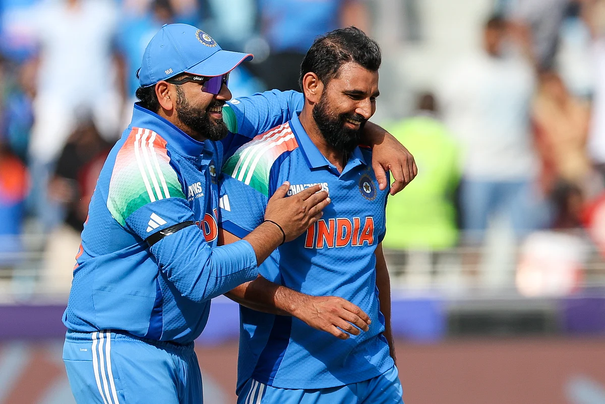 India's Mohammed Shami celebrates with skipper Rohit Sharma after dismissing Austrailan captain Steven Smith in the Champions Trophy semi-finals at Dubai International stadium.