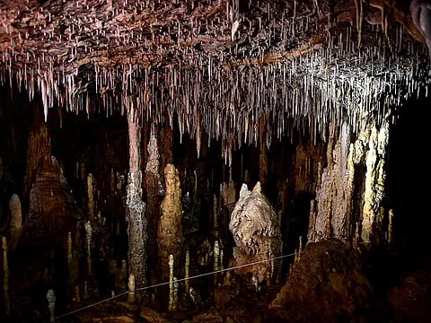 Mineral formations such as stalactites and stalagmites inside the Cussac cave. 