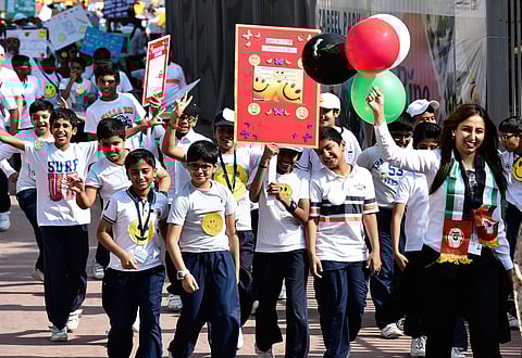 Students during the "walk for happiness" at a walkathon at Zabeel park to express their contentment, happiness, and gratitute towards their parents, family, school and UAE government for providing them with a wonderful environment. 