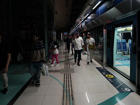 Dubai Metro passengers walk into a dark station as RTA switched off lights at Metro stations, roads and Customer Happiness Centres to observe Earth Hour from 8.30pm to 9.30pm on Saturday. 